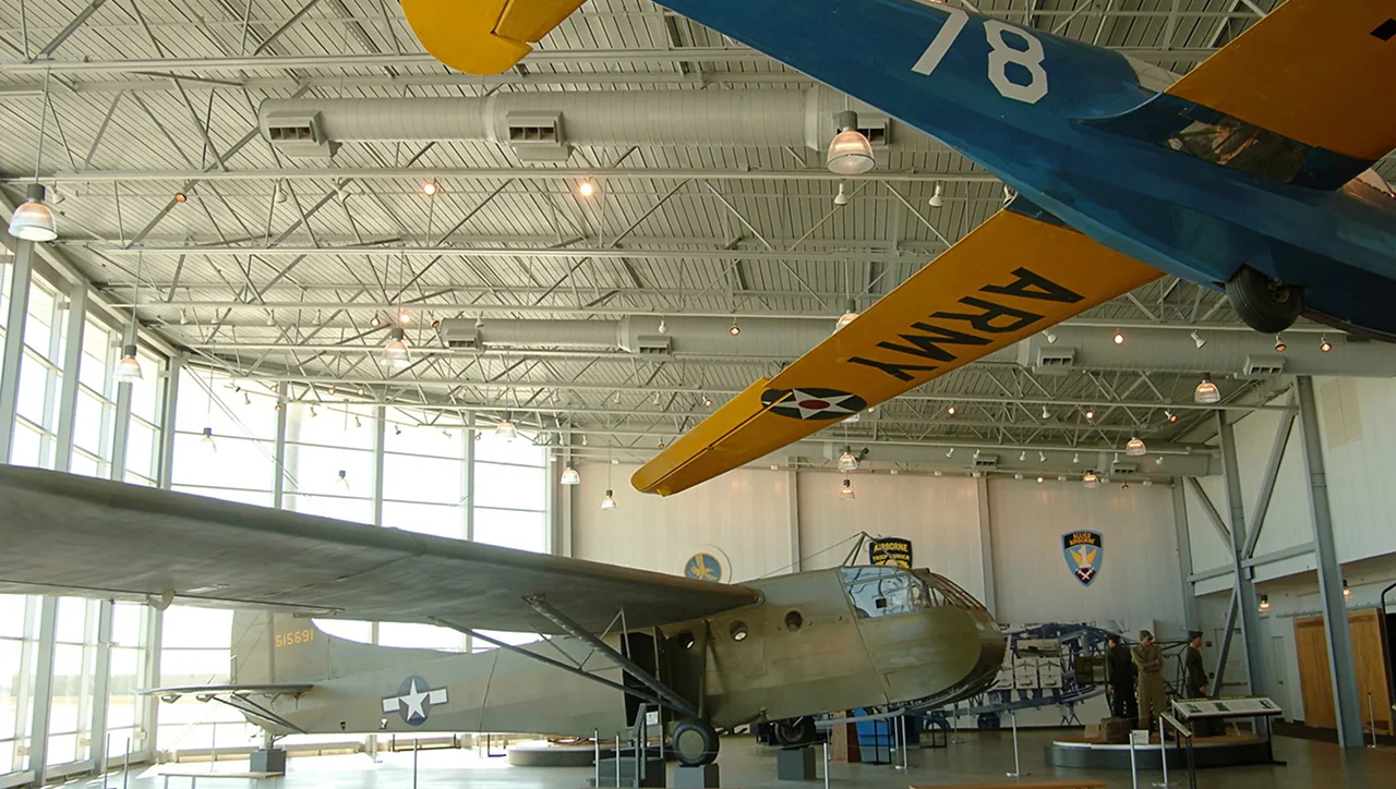 Vintage military aircraft on display in an aviation museum hangar